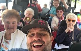 Group Smiles in Bus- Image Courtesy of Cedarwood at Sandy